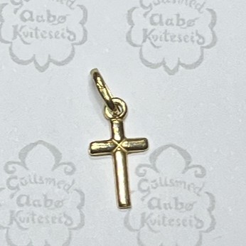 Gold cross pendant with a small loop for a chain, photographed on a light background.