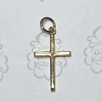 Gold-toned cross pendant with a circular loop at the top for attaching to a necklace.