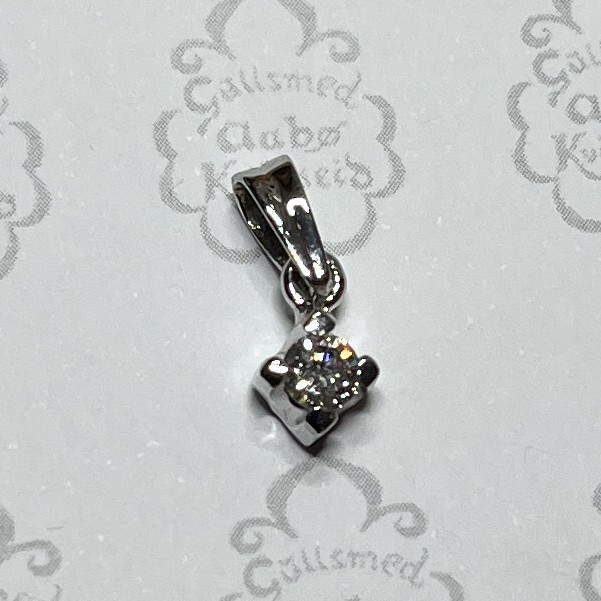 Gold pendant with a small round diamond secured in a four-prong setting, hanging from a polished bail.